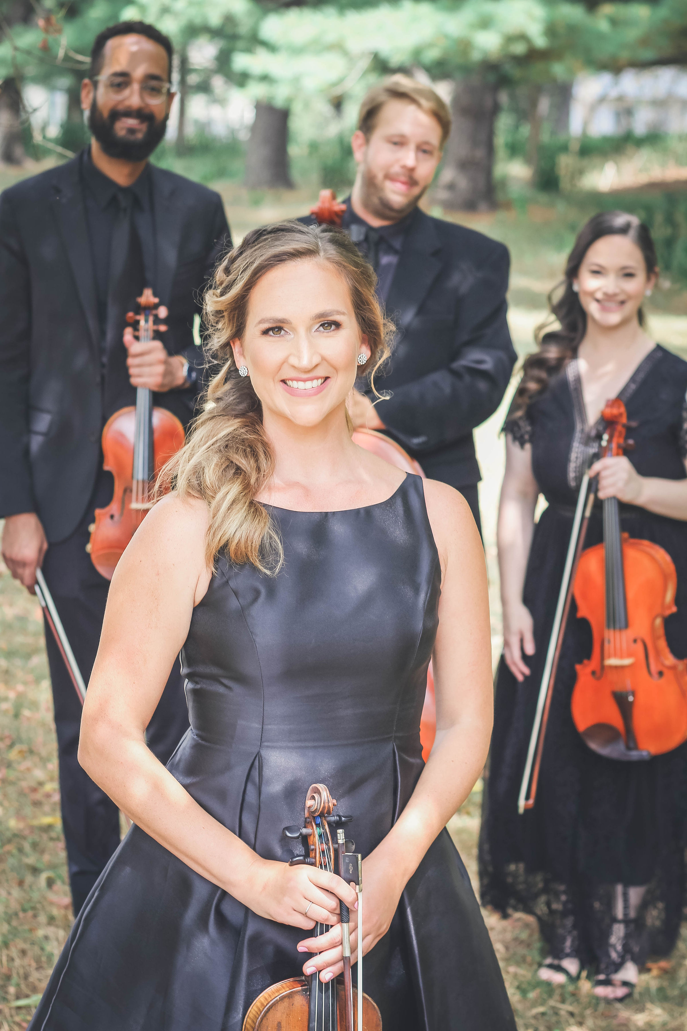 Maria Ramsay with the Simply Strings quartet, outdoors in formal black.